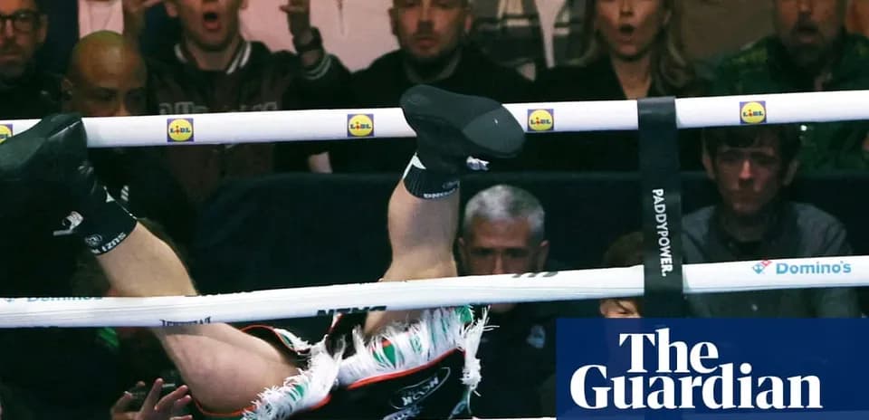 Boxer falling out of the ring during match
