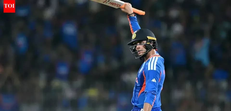 Jugador de cricket levantando el bate en celebración