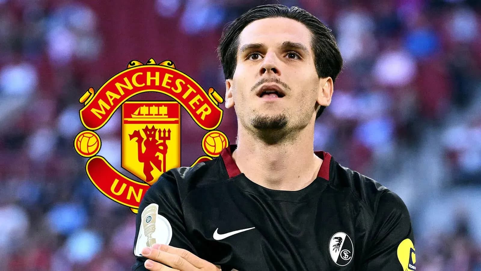Jugador con camiseta negra frente al logo de Manchester United Jugador con camiseta negra frente al logo de Manchester United
