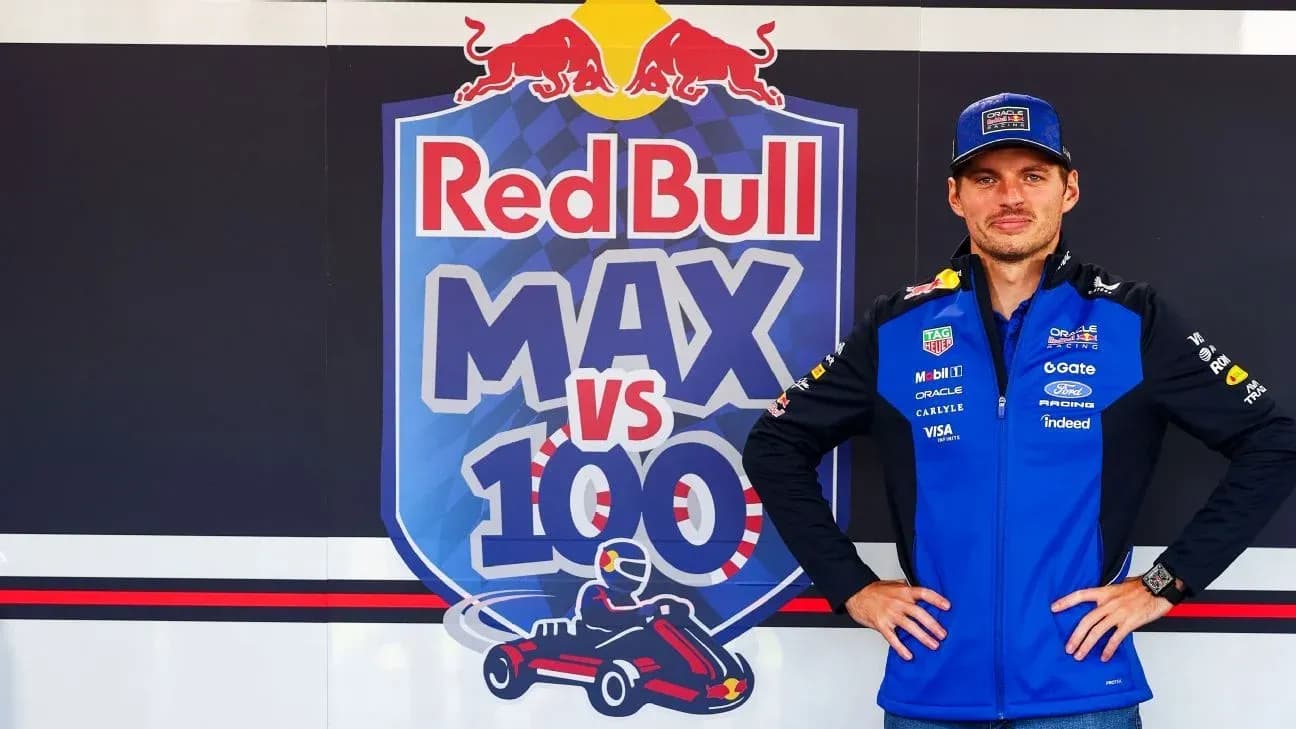 Piloto posando frente al logo de Red Bull Racing Piloto posando frente al logo de Red Bull Racing