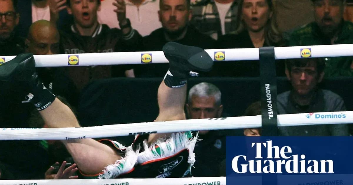 Boxer falling out of the ring during match Boxer falling out of the ring during match