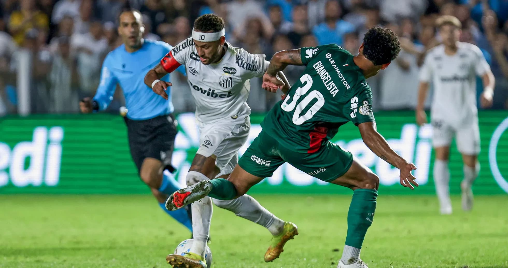 Neymar dribbling past a defender during match Neymar dribbling past a defender during match