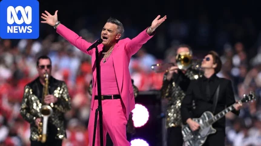 Robbie Williams cantando en un evento musical Robbie Williams cantando en un evento musical