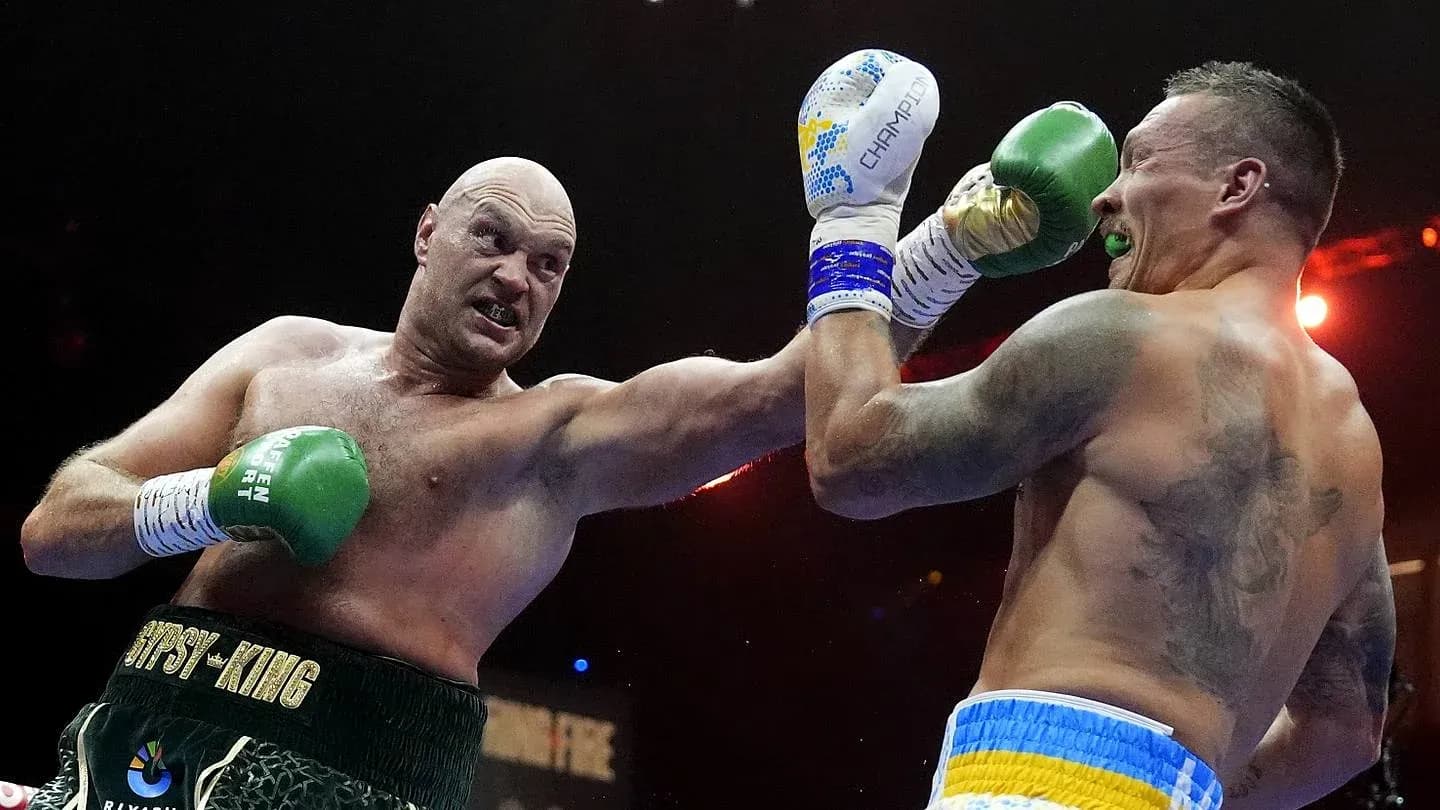 Tyson Fury landing a punch on Oleksandr Usyk Tyson Fury landing a punch on Oleksandr Usyk