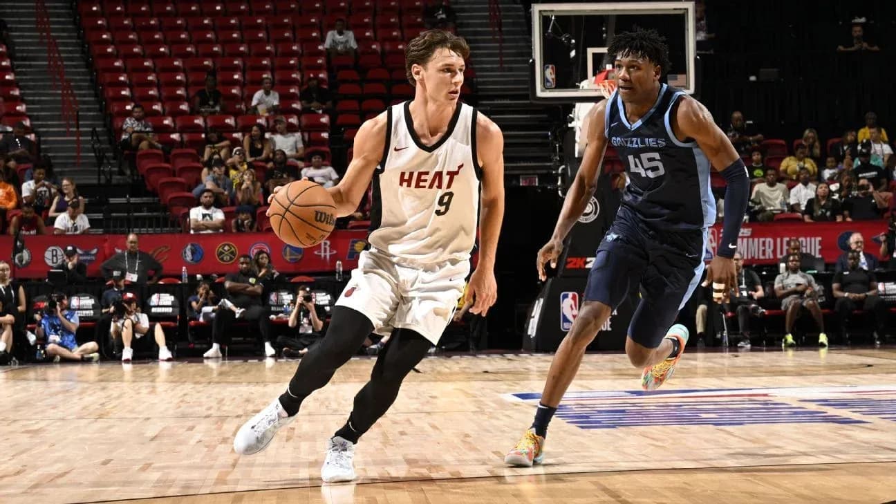 Jugador de Miami Heat driblando contra jugador de Memphis Grizzlies Jugador de Miami Heat driblando contra jugador de Memphis Grizzlies
